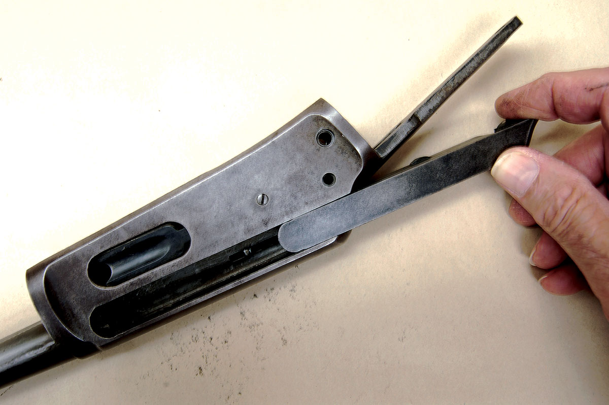 Once other parts are removed, the breechblock simply slides out of the receiver.